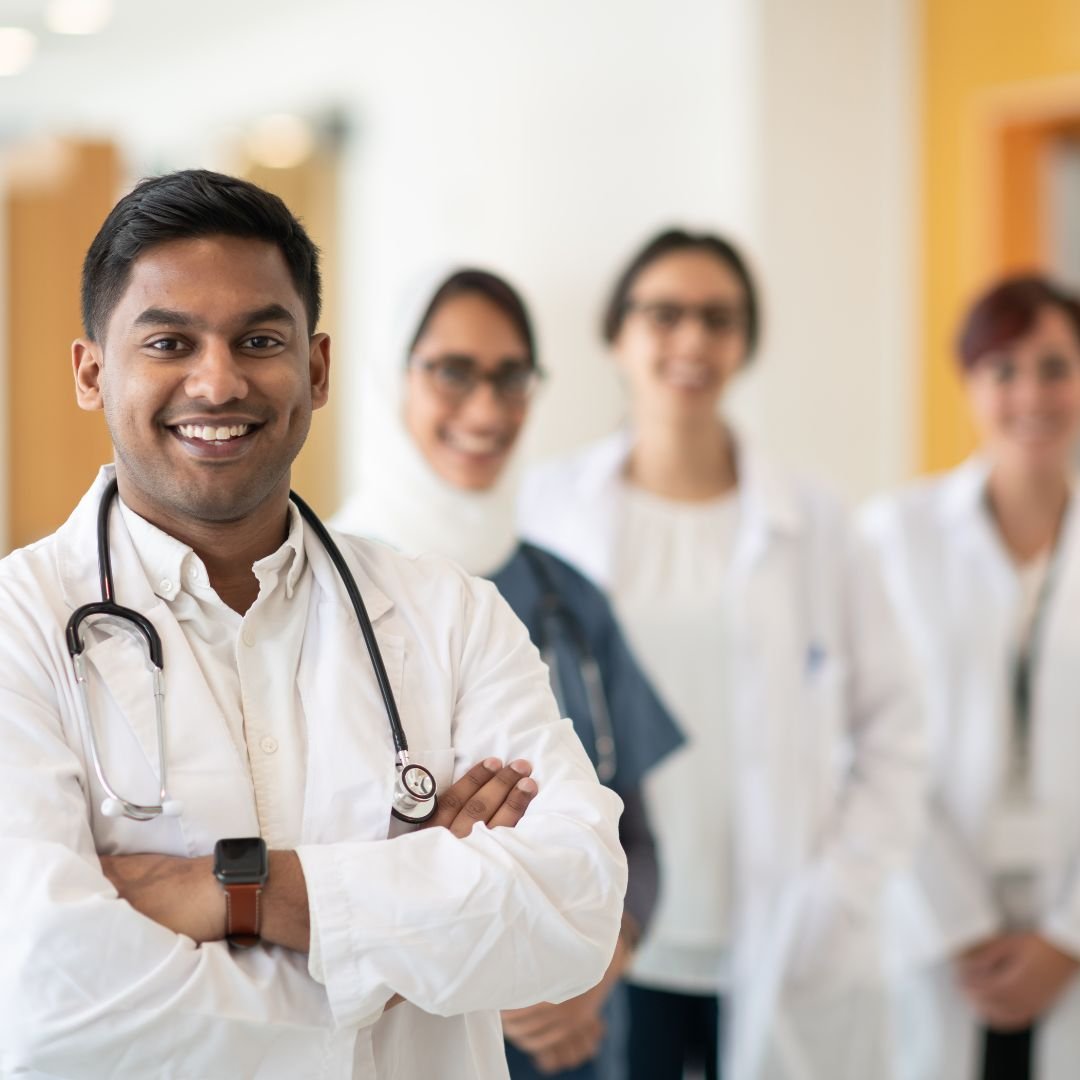 a group of doctors similing posing for sasha foundation picture
